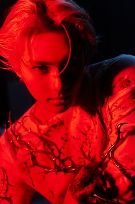 a young man with red light on his body