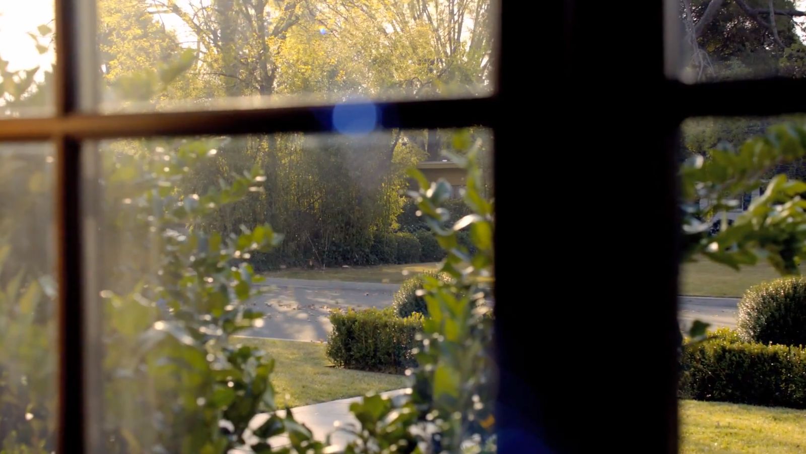 a view of a street through a window