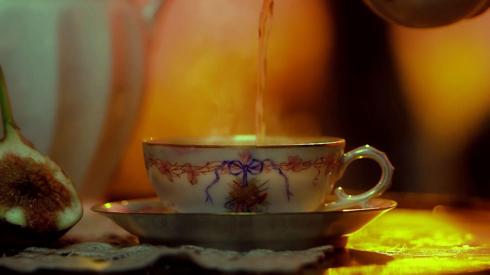 a cup of tea is being poured into it