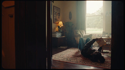 a person laying on the floor reading a book