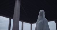 a statue of a woman in a white veil