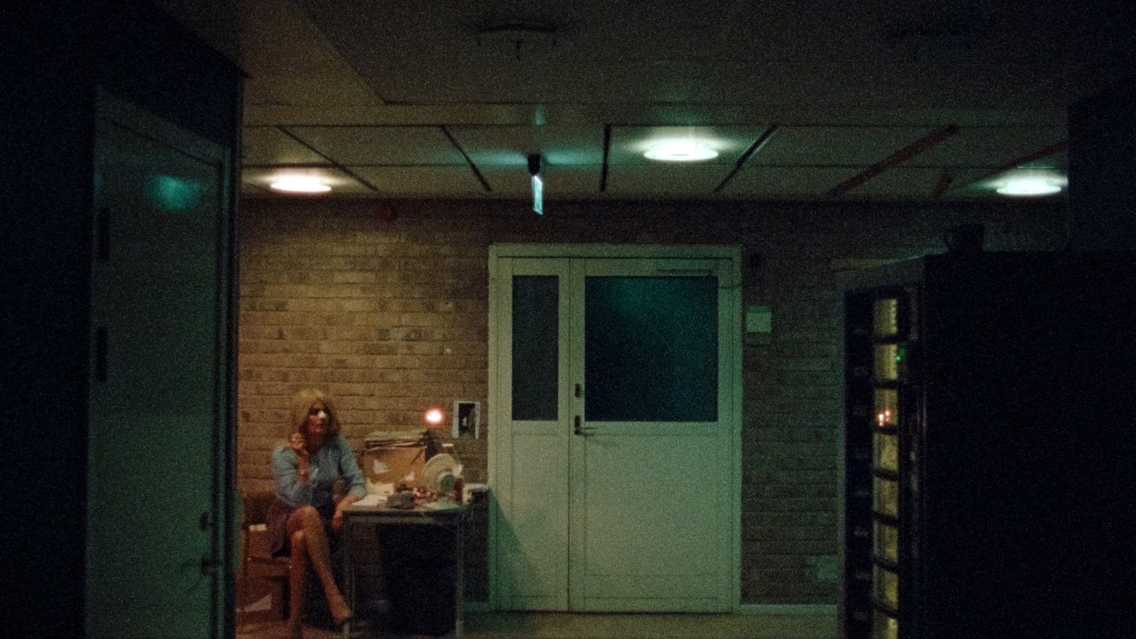 a woman sitting on a chair in a room