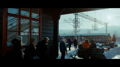 a group of people standing outside of a building