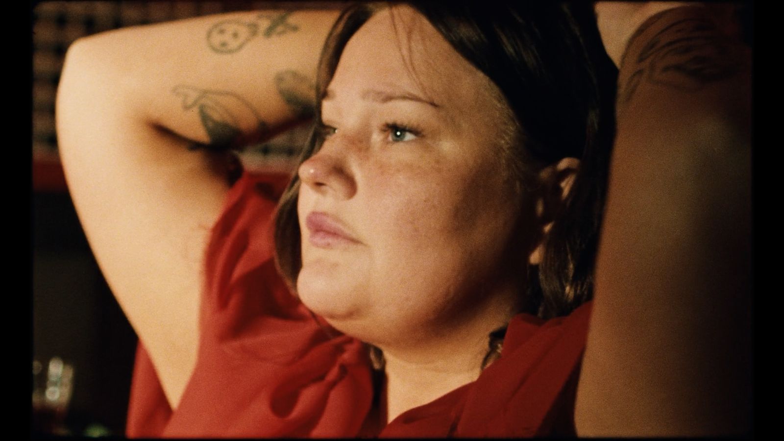 a woman with a tattoo on her arm