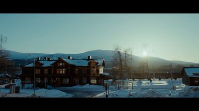 a large house with a lot of snow on the ground