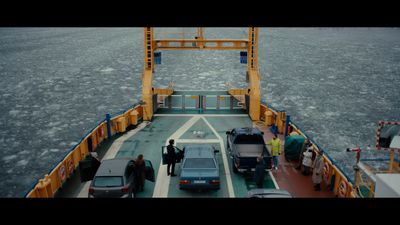 a ferry with cars on the ferry deck