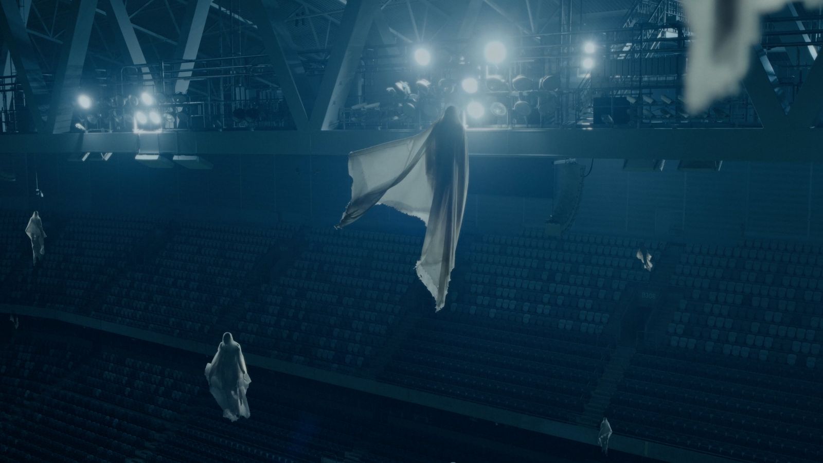 a white flag flying in the air in a stadium