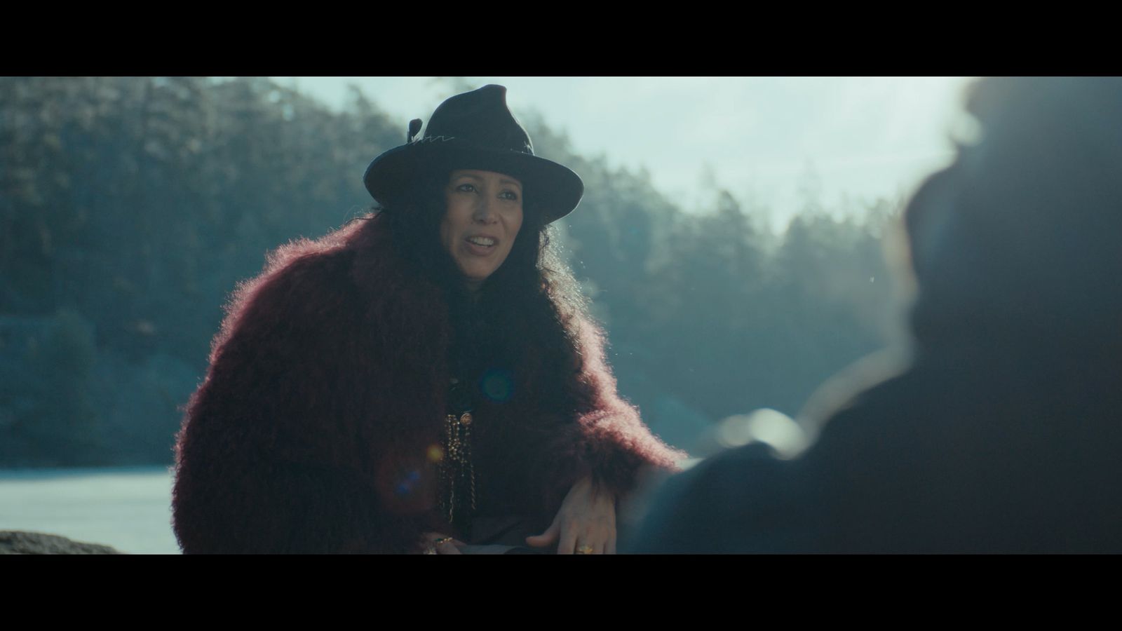 a woman wearing a hat and a fur coat