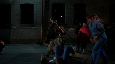 a group of people standing in a parking lot