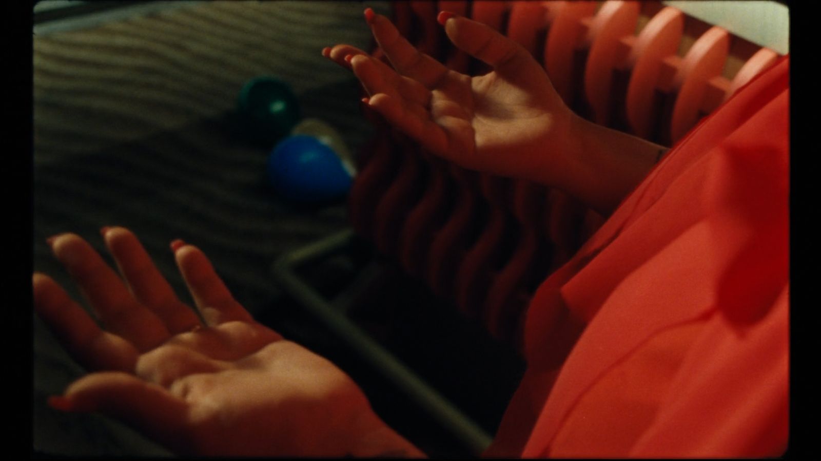 a person with their hands up in front of a radiator