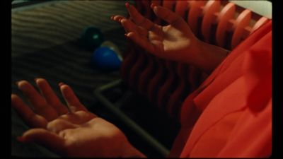 a person with their hands up in front of a radiator