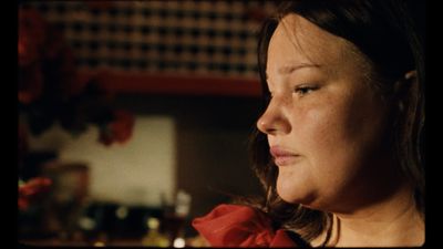 a close up of a woman in a kitchen