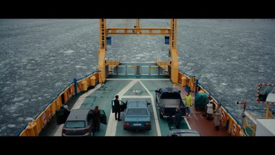 a ferry with cars on the deck of it