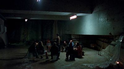 a group of people standing in a dark room