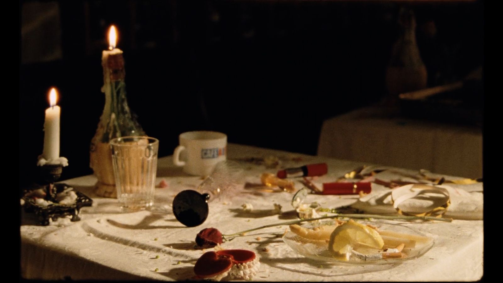 a table topped with lots of food and candles