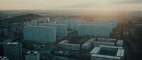 an aerial view of a city with tall buildings