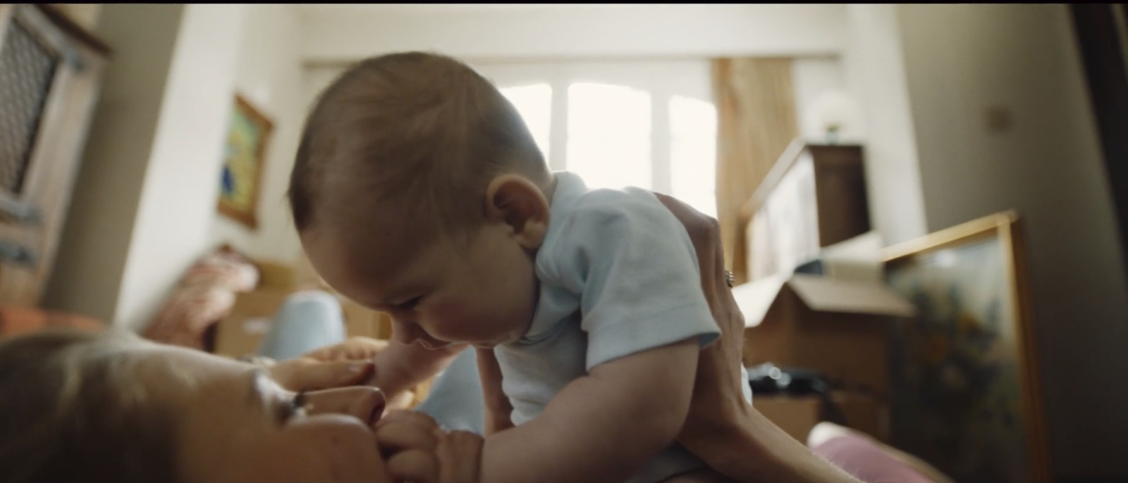 a woman holding a baby in her arms