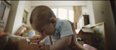 a woman holding a baby in her arms