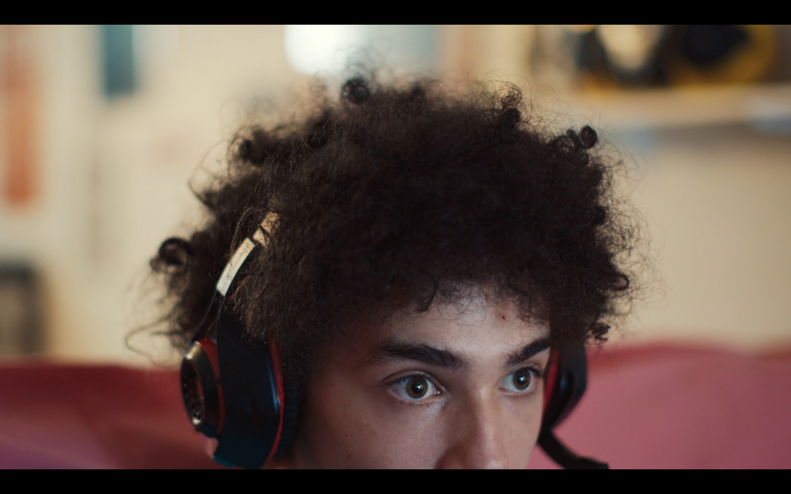 a young man with headphones on his ears