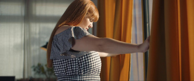 a woman looking out of a window