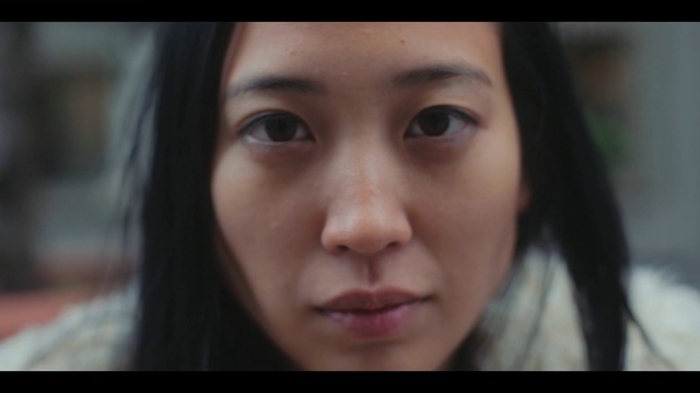 a close up of a person with long hair