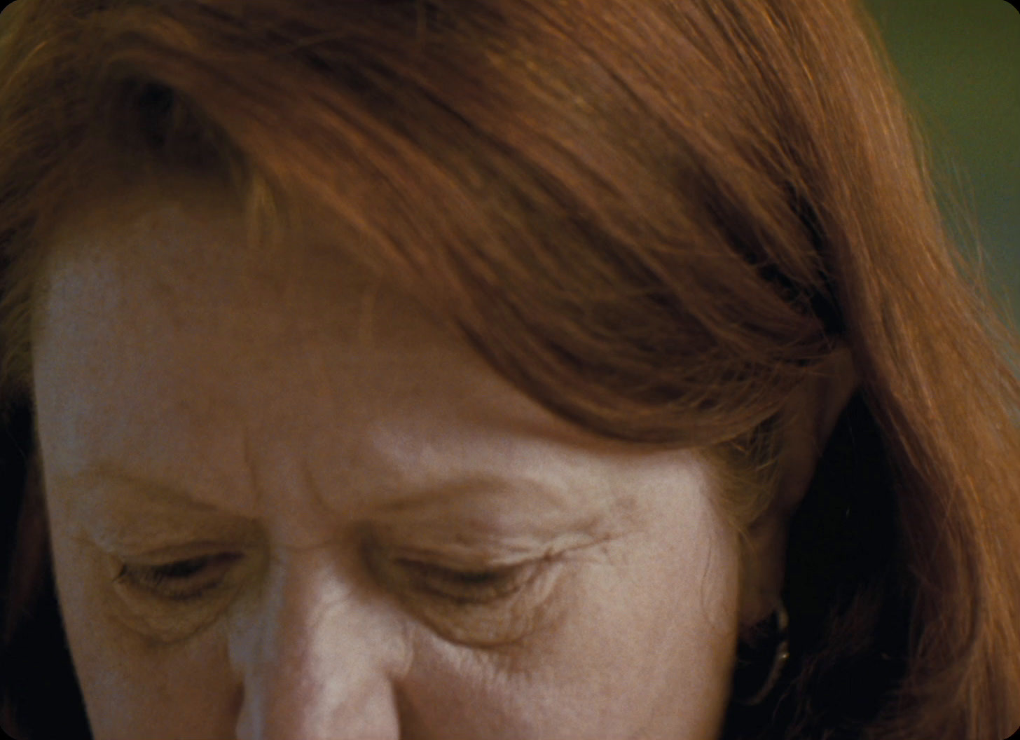 a close up of a woman with red hair