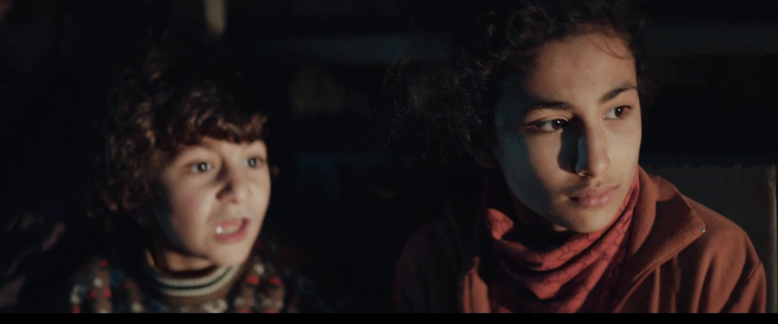  two young girls are staring at the camera