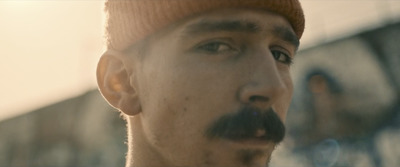  a close up of a person wearing a hat