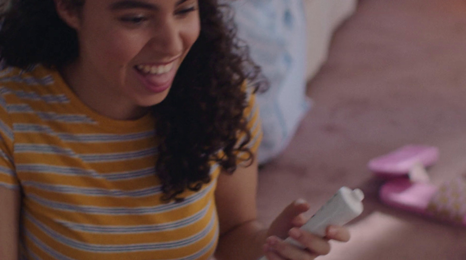 a woman is playing with a wii remote