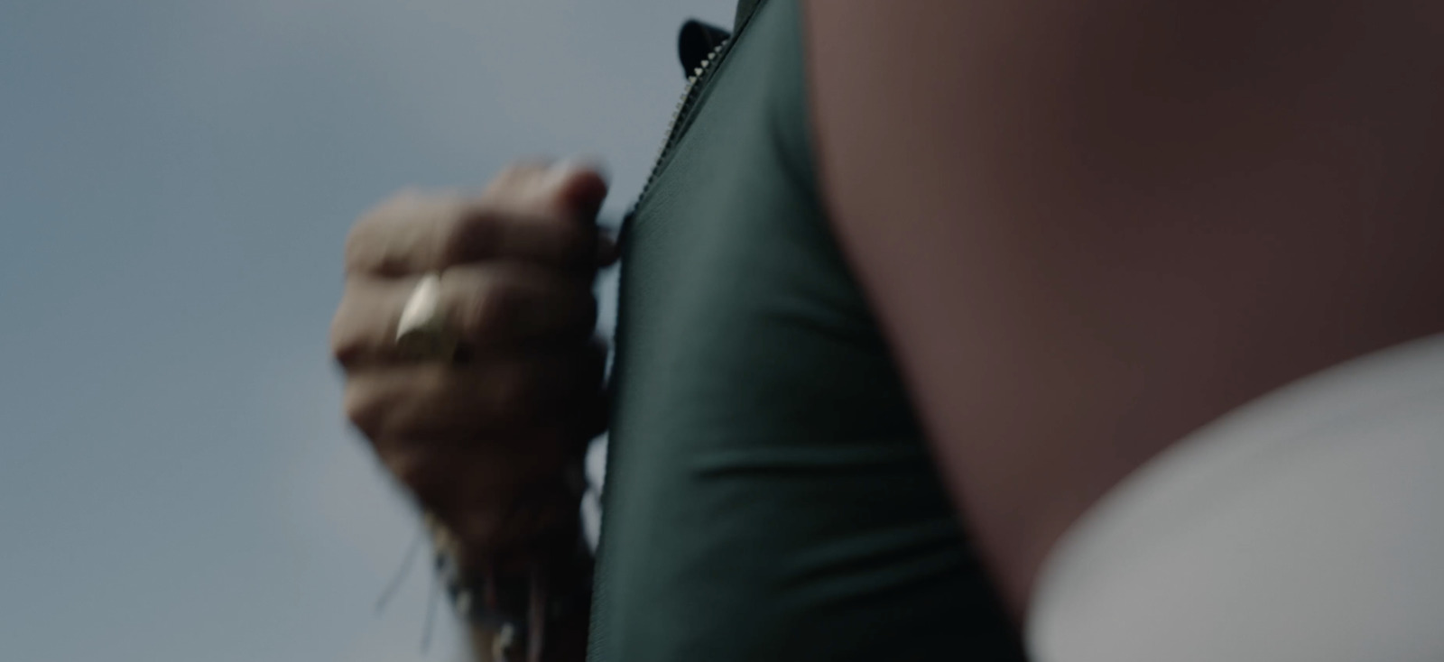 a person holding a white frisbee in their hand