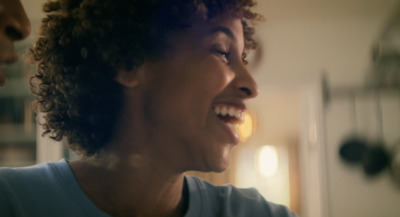 a close up of a person laughing in a room