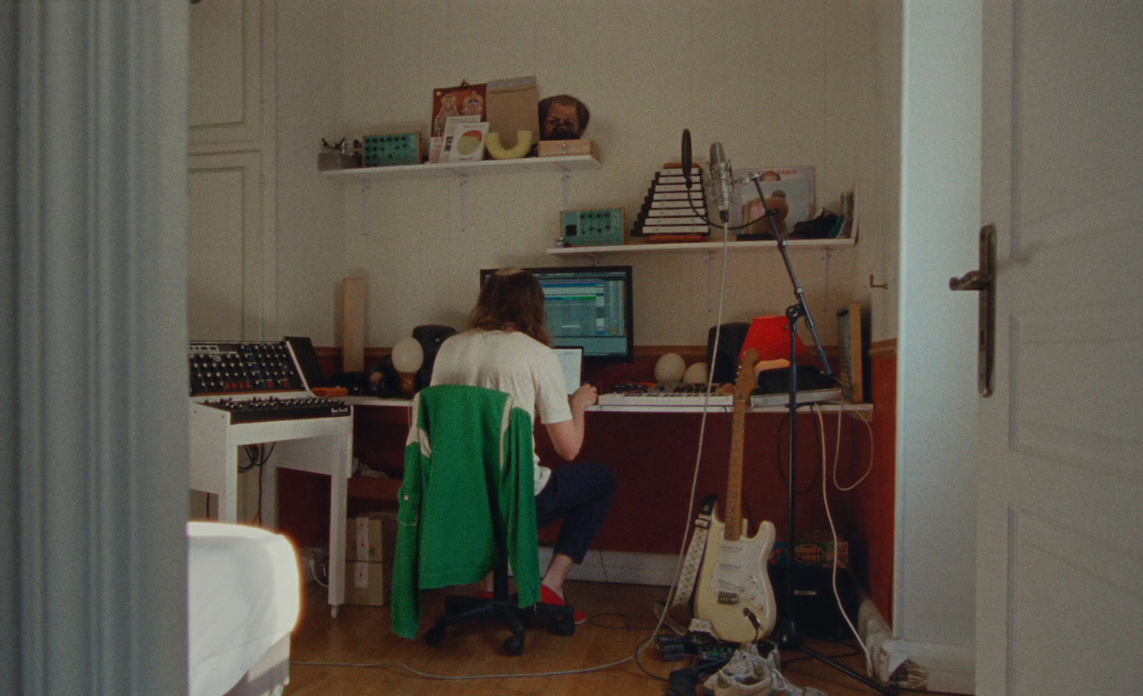 a person sitting at a desk in a room