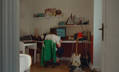 a person sitting at a desk in a room