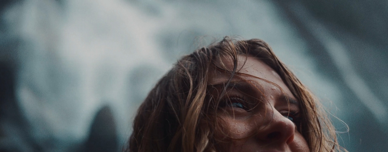 a close up of a person with long hair