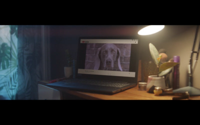 a laptop computer sitting on top of a wooden desk