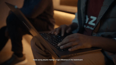 a person typing on a laptop on a couch