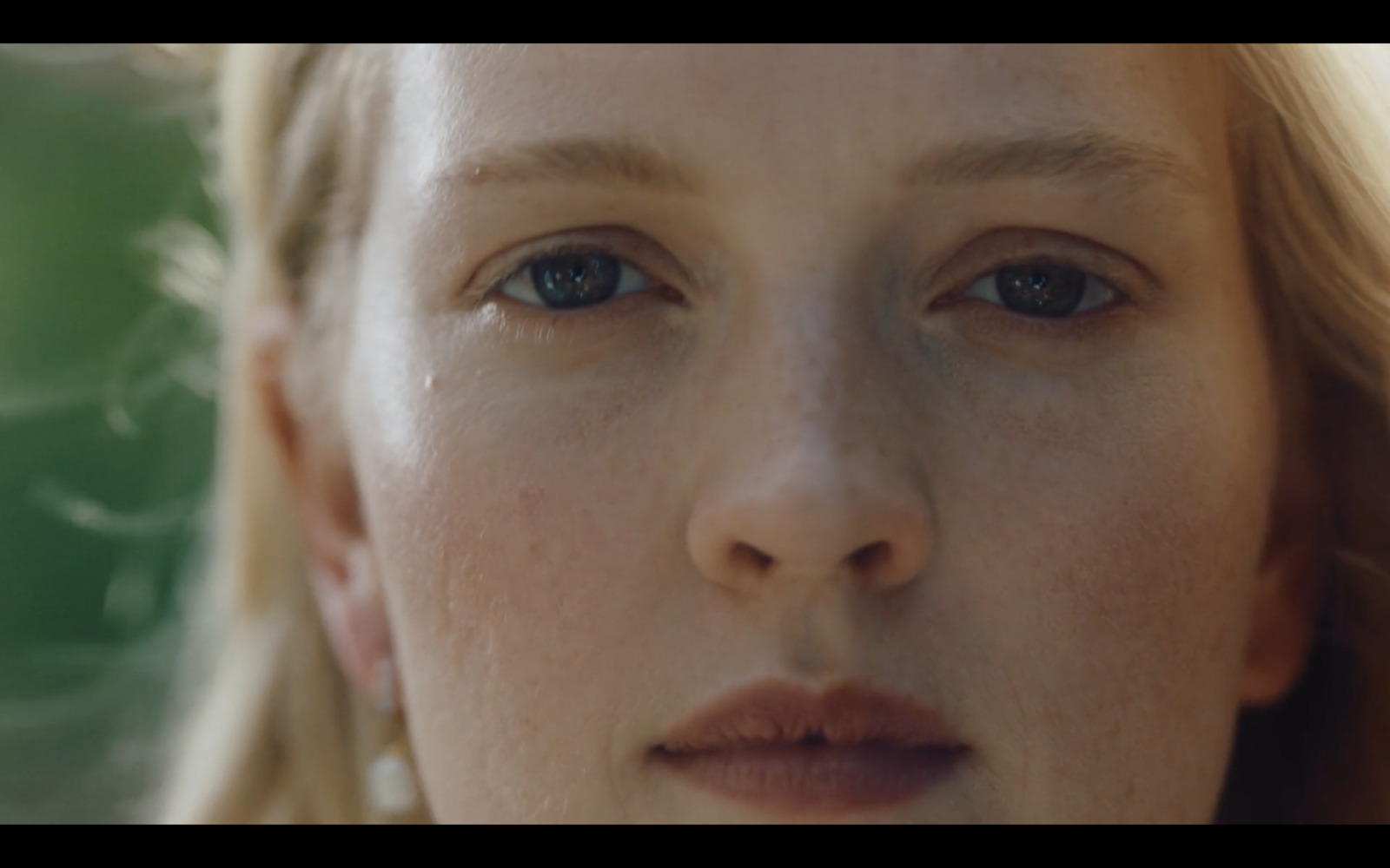 a close up of a woman with blond hair