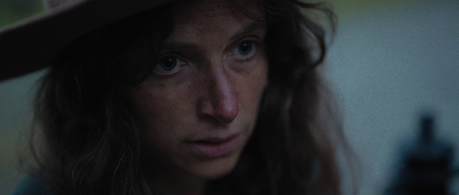 a close up of a person wearing a hat