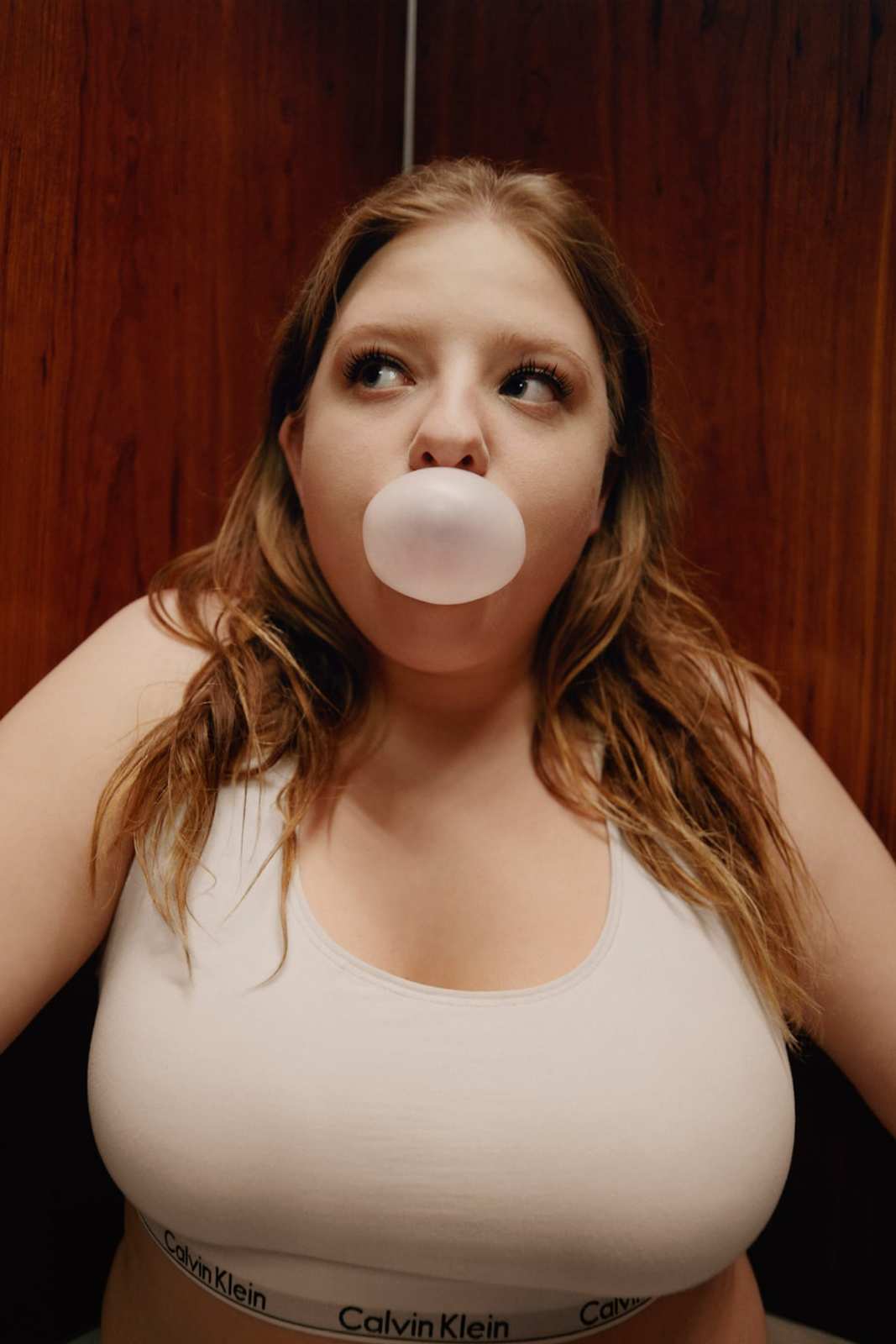 a woman with a bubble in her mouth