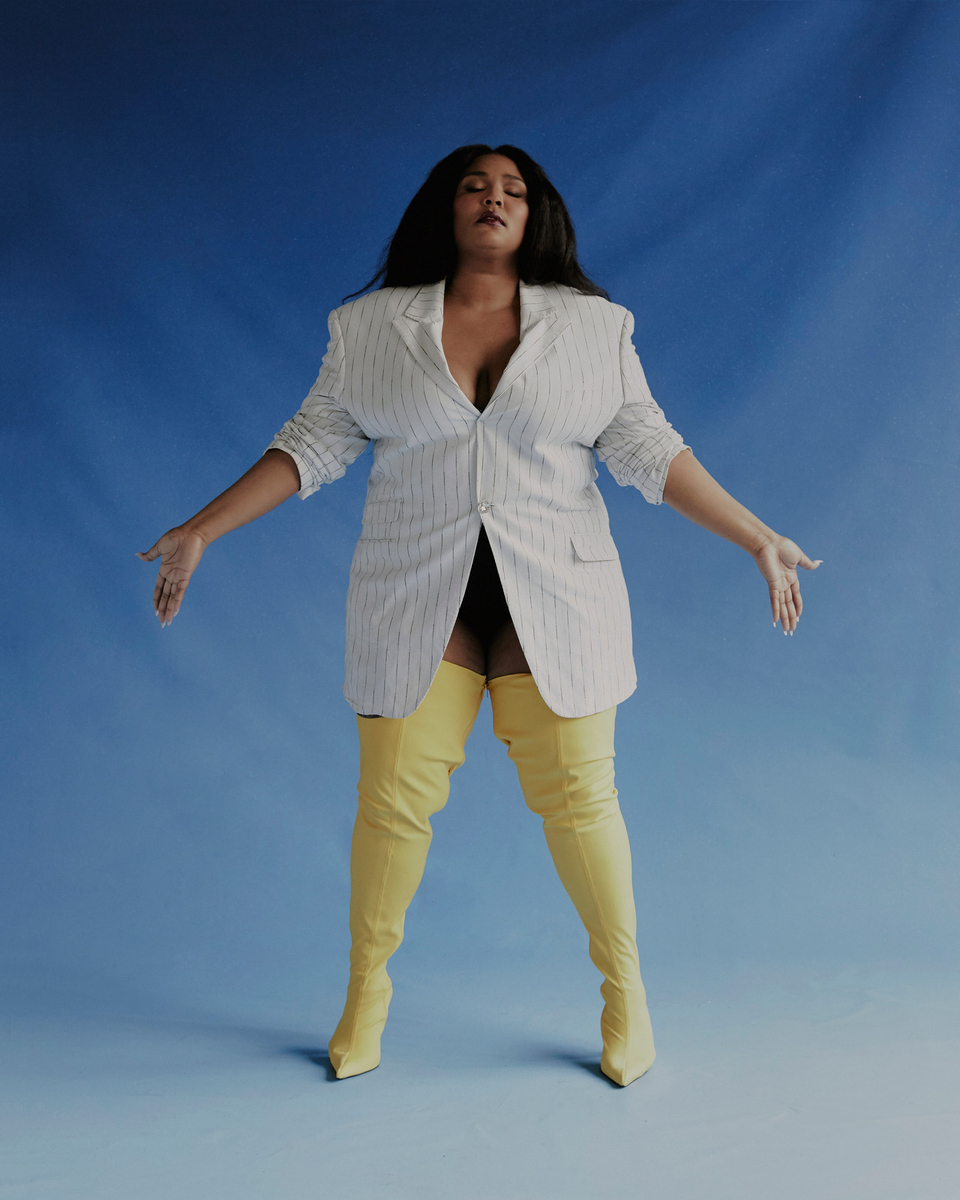 a woman in a white jacket and yellow pants