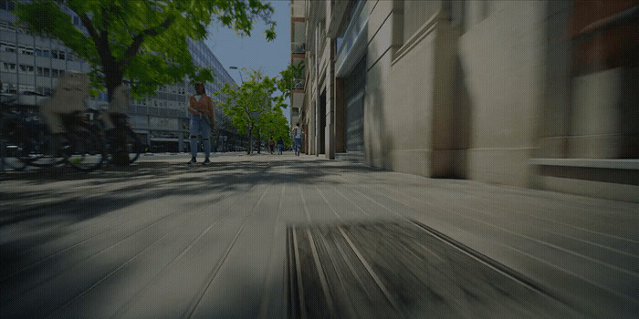 a blurry photo of a person walking down a street