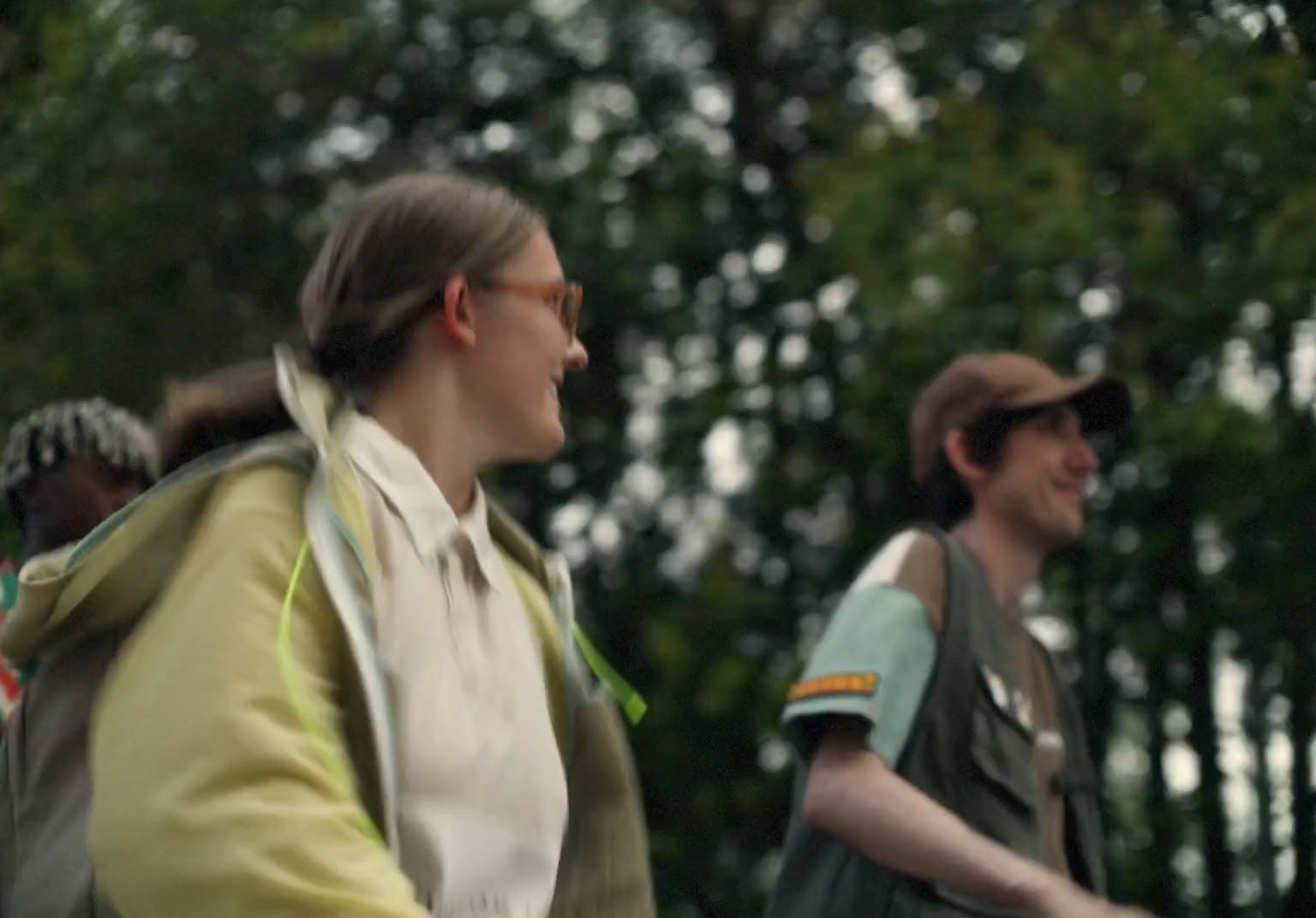 a group of people riding bikes in the woods