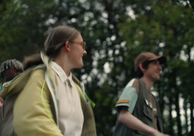 a group of people riding bikes in the woods