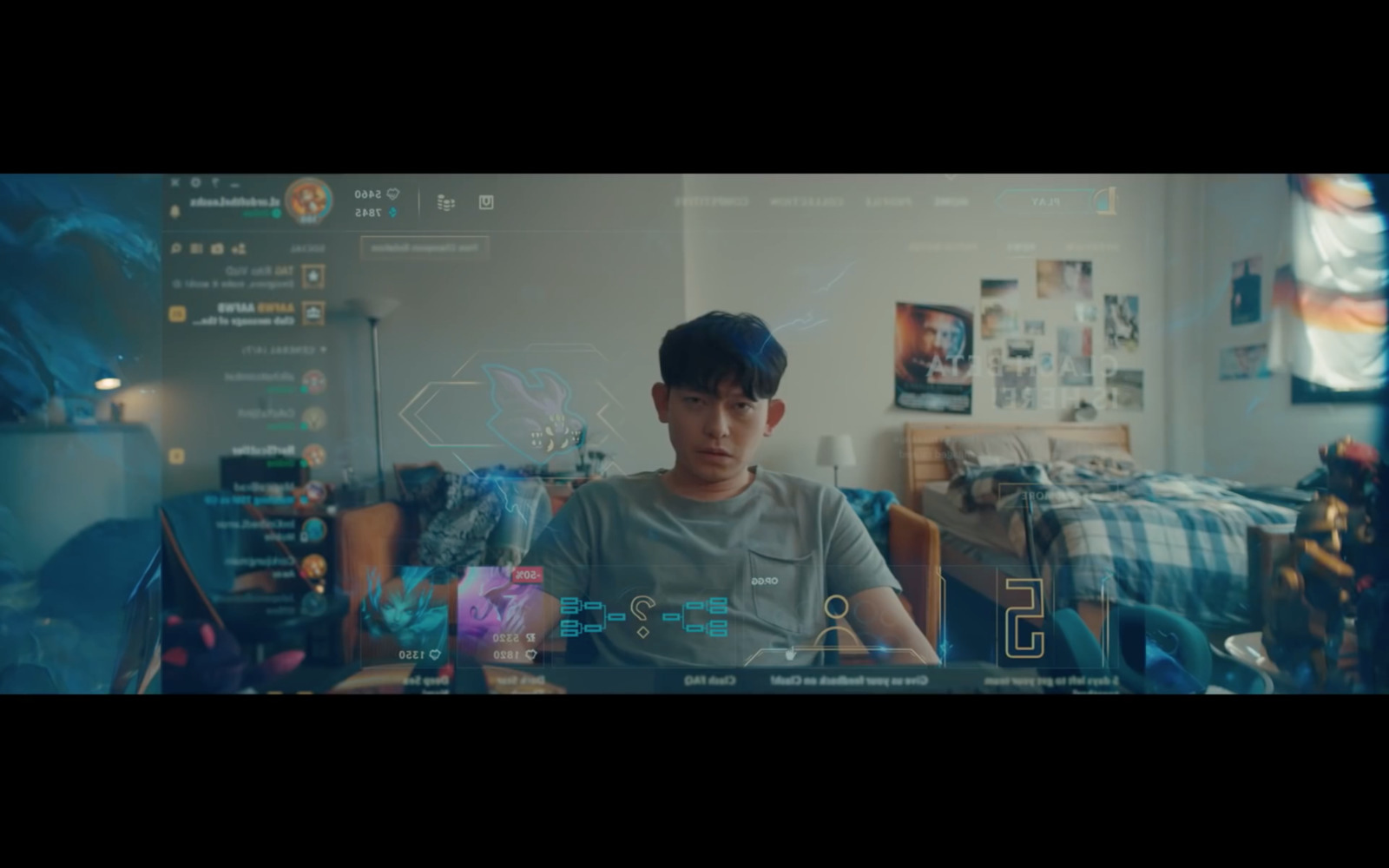 a boy sitting in front of a laptop computer