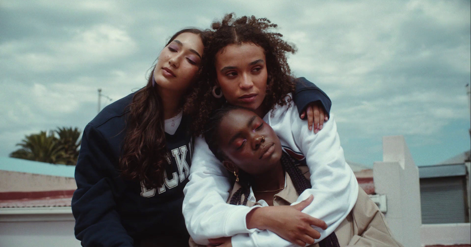 a group of young people hugging each other