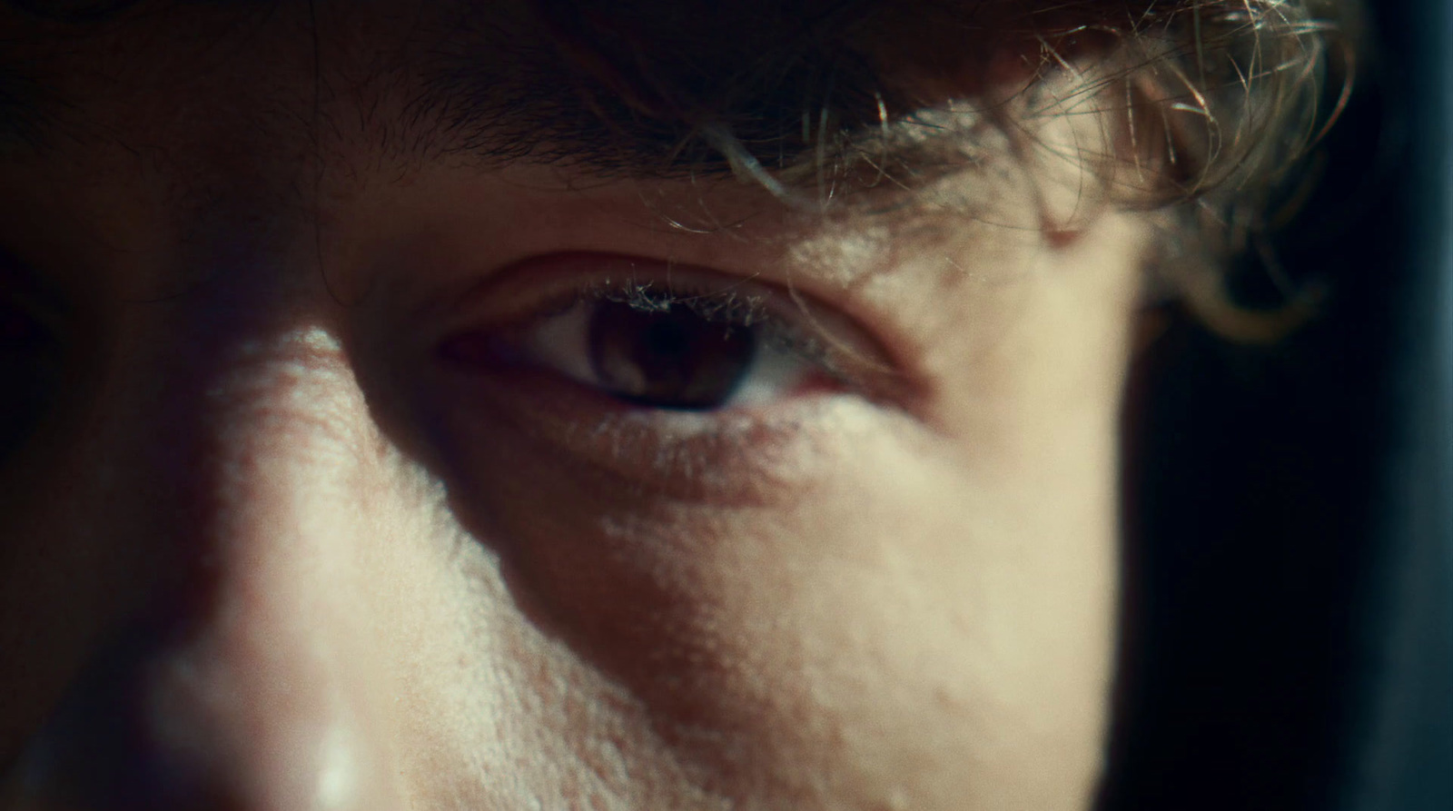 a close up of a person's eye with a blurry background