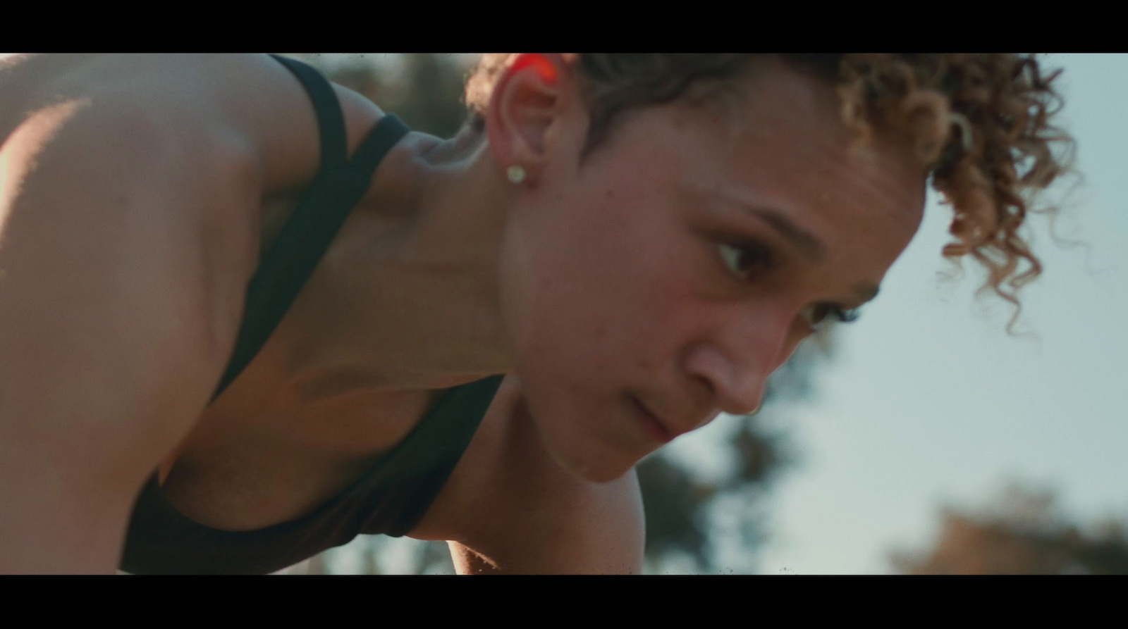 a close up of a person wearing a tank top