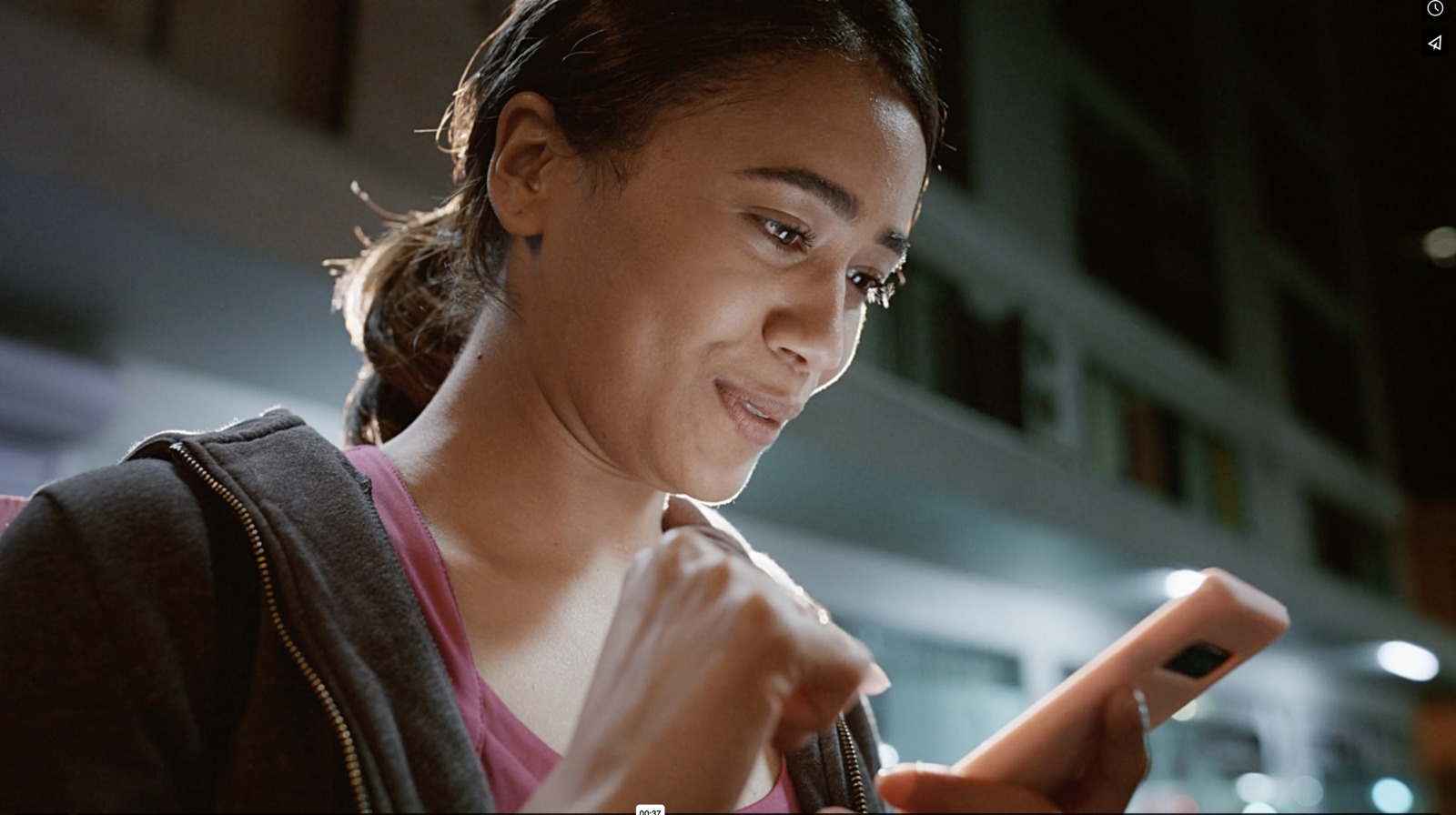 a woman is looking at her cell phone