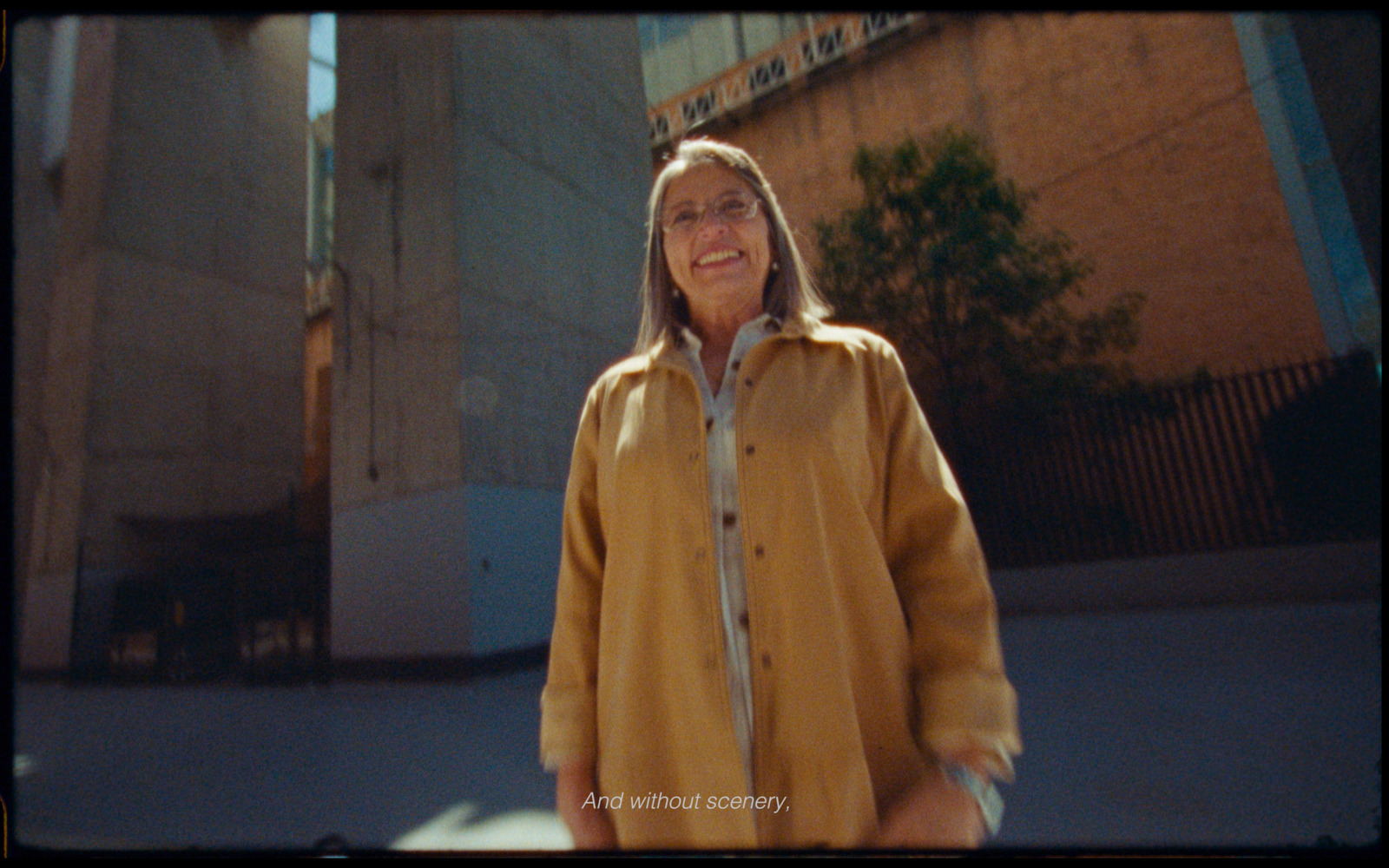  a woman standing in front of a building