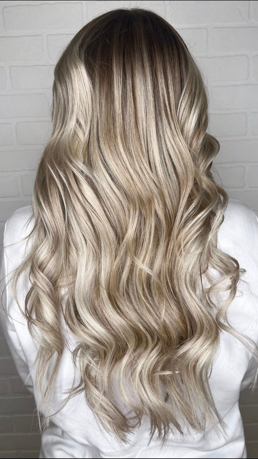 the back of a woman's head with blonde hair